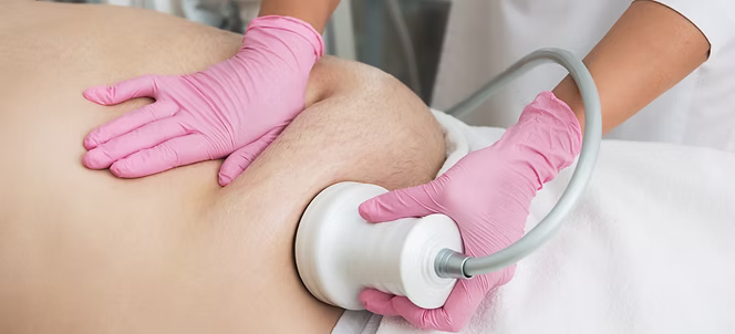 Body contouring device used on a client’s midsection.